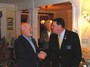 PDG Jim Pierce congratulates Cap Neilson, who has now become a level 7 Paul Harris Fellow.